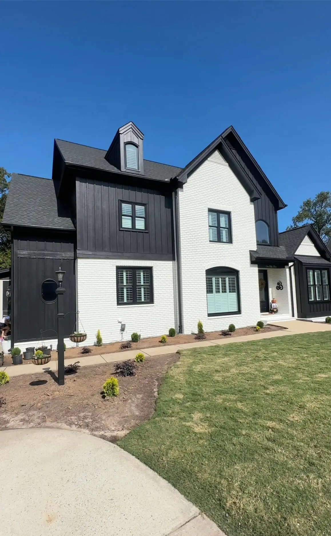 Exterior of a recently painted modern home by a painting company in Clayton NC showcasing professional craftsmanship and clean finishes.